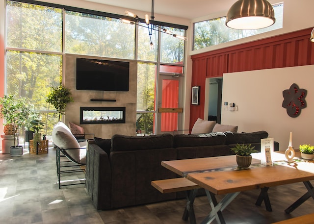 interior space with a fireplace and a high ceiling