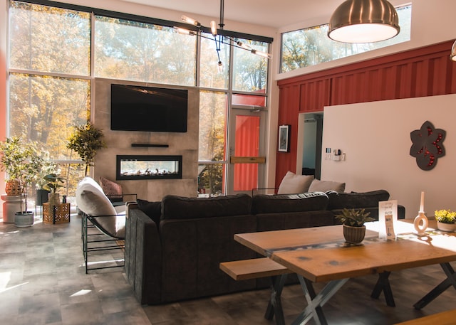 interior space featuring a towering ceiling and a tile fireplace