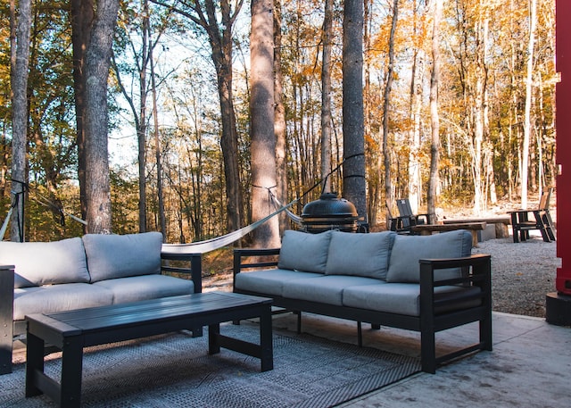 view of patio with outdoor lounge area and a grill