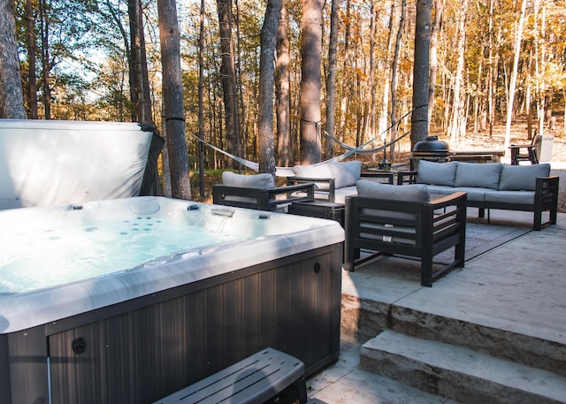 view of patio featuring an outdoor living space and a hot tub