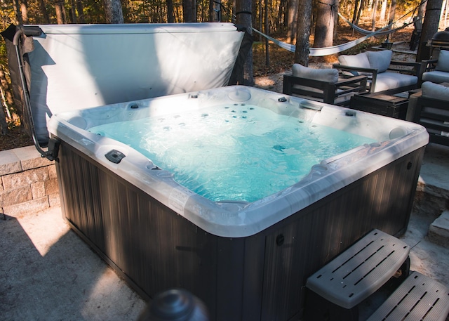 deck featuring a hot tub