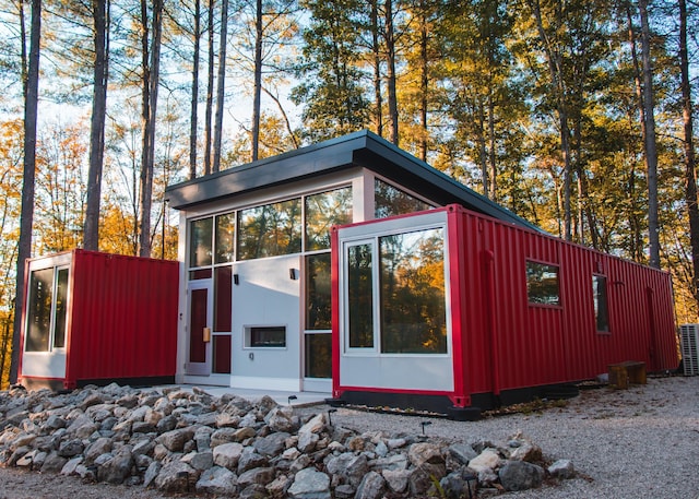 view of outdoor structure featuring a sunroom