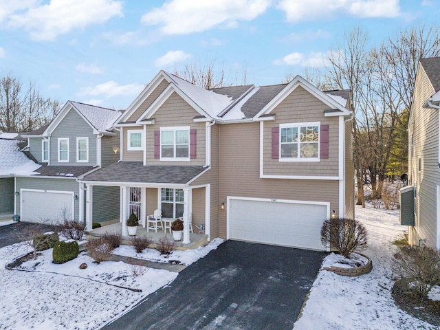 view of front of home with a garage and covered porch