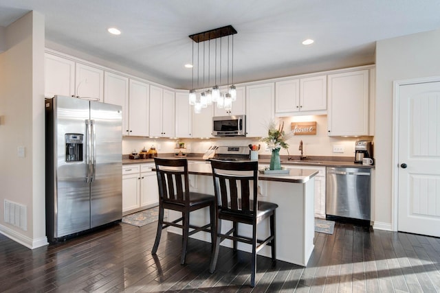 kitchen featuring appliances with stainless steel finishes and white cabinets