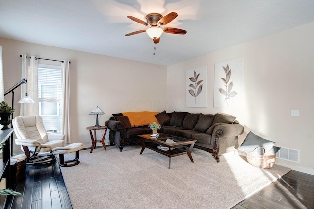 living room with hardwood / wood-style flooring and ceiling fan