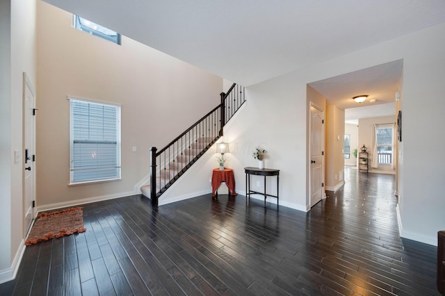 foyer entrance featuring dark hardwood / wood-style flooring