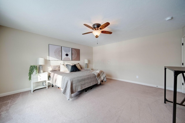 bedroom with light carpet and ceiling fan