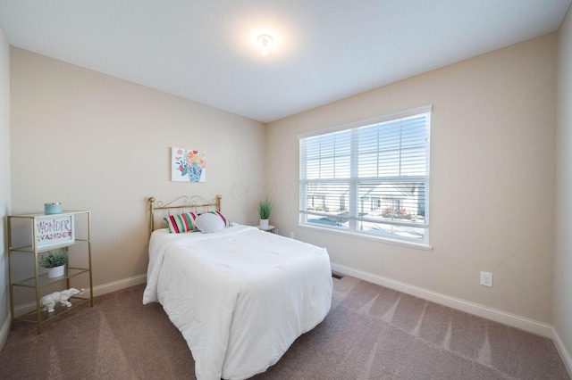 bedroom featuring carpet