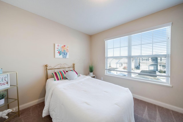 bedroom with dark carpet