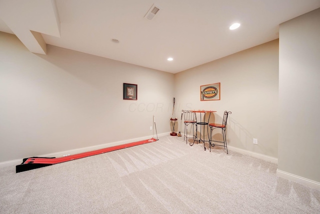 living area featuring light colored carpet