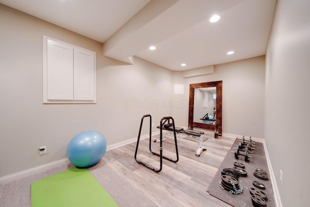 exercise area with light wood-type flooring