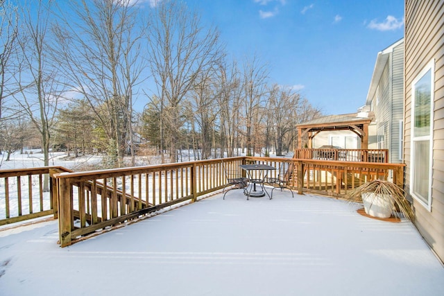 snow covered deck featuring a gazebo