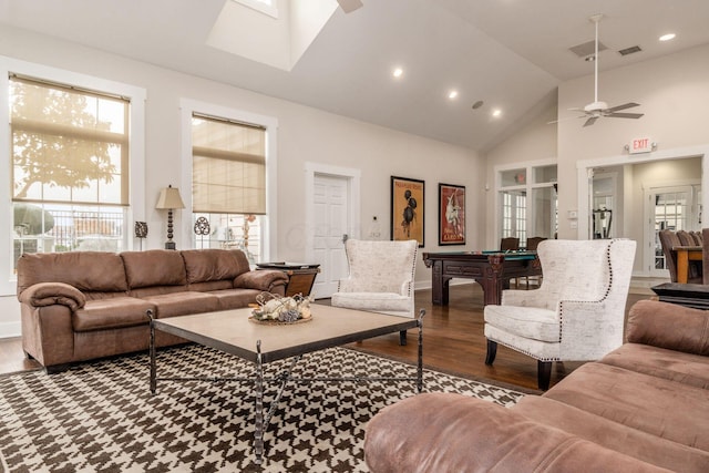 living room featuring ceiling fan, hardwood / wood-style floors, a skylight, high vaulted ceiling, and pool table