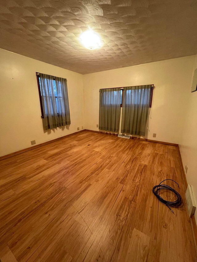 empty room featuring hardwood / wood-style floors