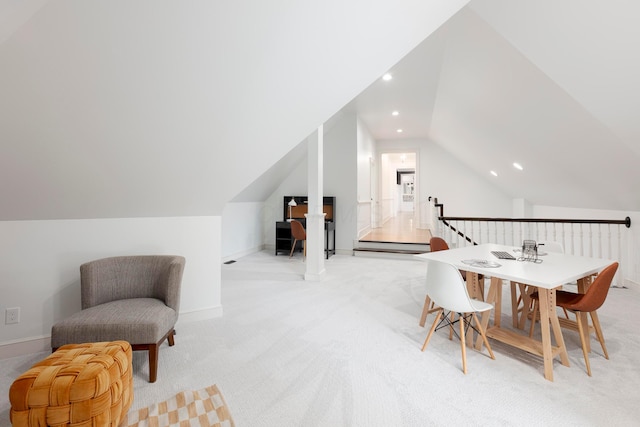 interior space featuring lofted ceiling and a baseboard heating unit