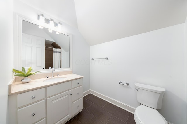 bathroom with vanity, lofted ceiling, a shower with shower curtain, and toilet