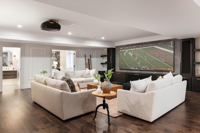 living room with dark wood-type flooring and crown molding