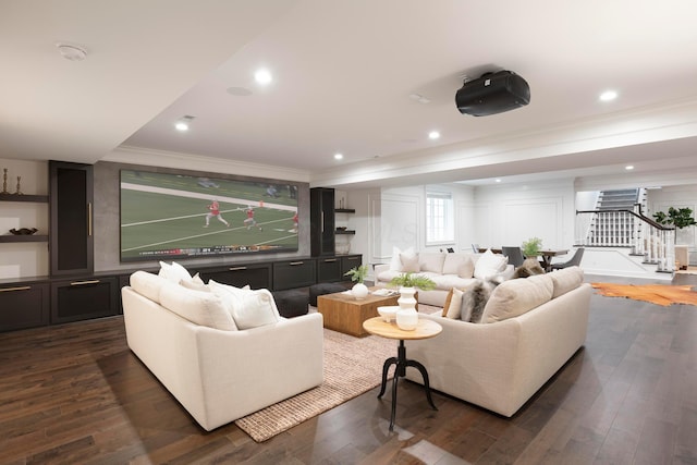 living room featuring ornamental molding and dark hardwood / wood-style flooring