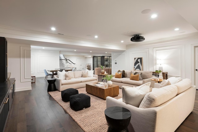 living room featuring dark wood-type flooring and ornamental molding