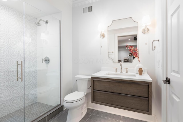 bathroom featuring tile patterned floors, toilet, an enclosed shower, and vanity