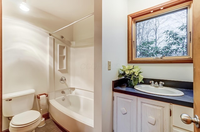 full bathroom with toilet, vanity, and tub / shower combination