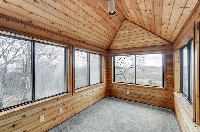 unfurnished sunroom featuring vaulted ceiling and wood ceiling