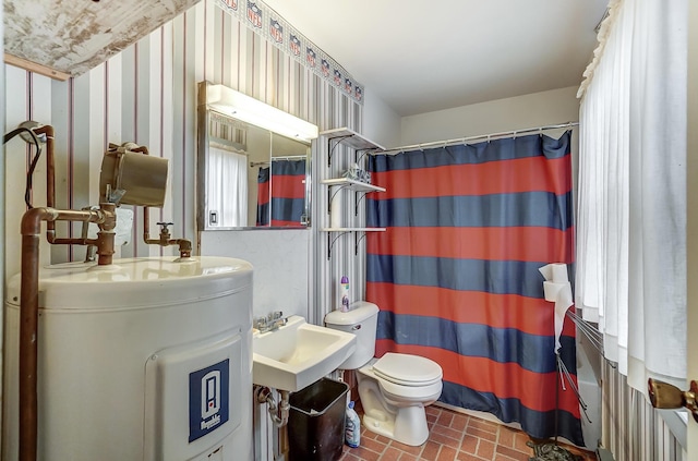 bathroom with a shower with shower curtain, electric water heater, toilet, and sink