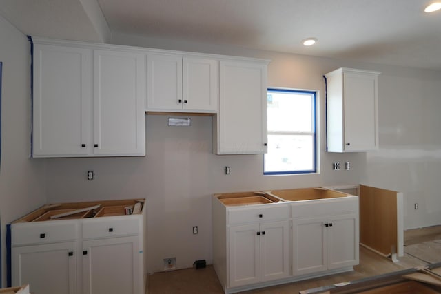 kitchen with sink and white cabinetry