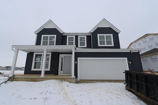 view of front of house featuring a garage and covered porch