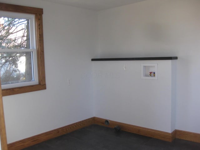 laundry room with hookup for a washing machine and tile patterned flooring