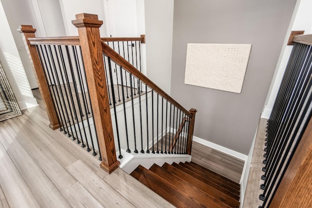 stairs with wood-type flooring