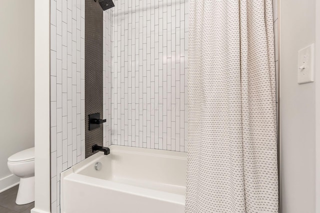 bathroom featuring tile patterned floors, toilet, and shower / bathtub combination with curtain