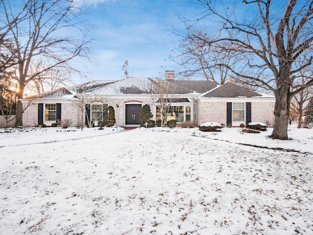 view of snow covered house