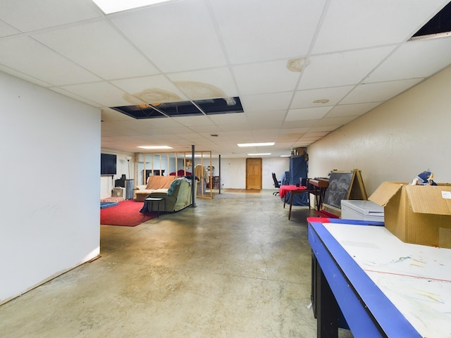 basement featuring a paneled ceiling