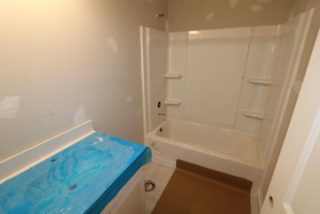 bathroom featuring shower / tub combination, vanity, and tile patterned flooring