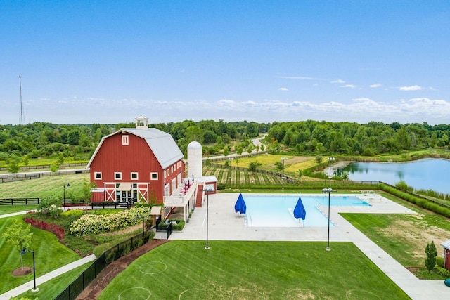 8285 Canopy Glen Dr, Plain City, OH 43064 - view of pool with a barn, an outbuilding, and a water view
