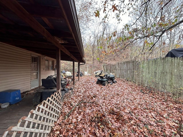 view of yard with a wooden deck