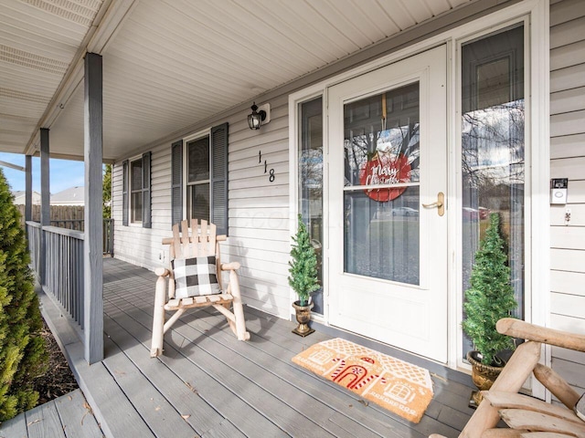 wooden terrace with a porch