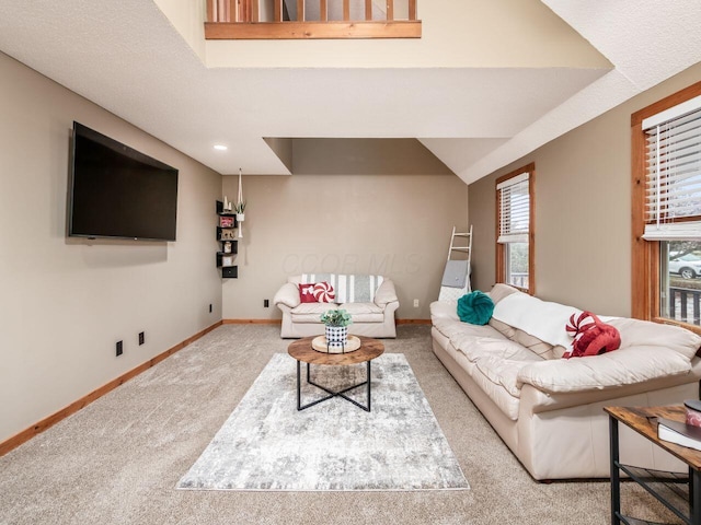 living room featuring light colored carpet and a textured ceiling