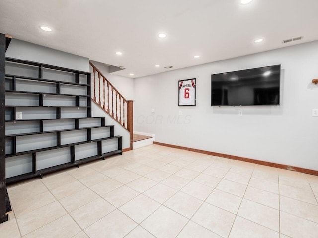 basement with light tile patterned flooring