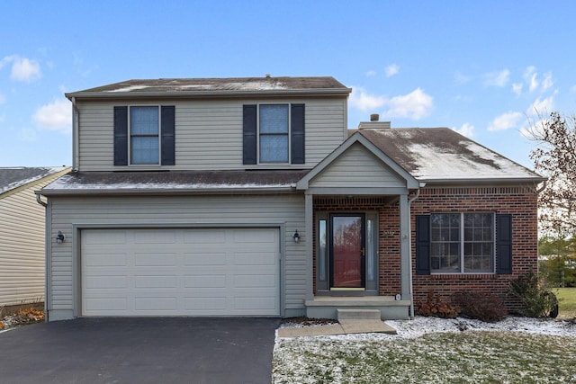 front of property with a garage