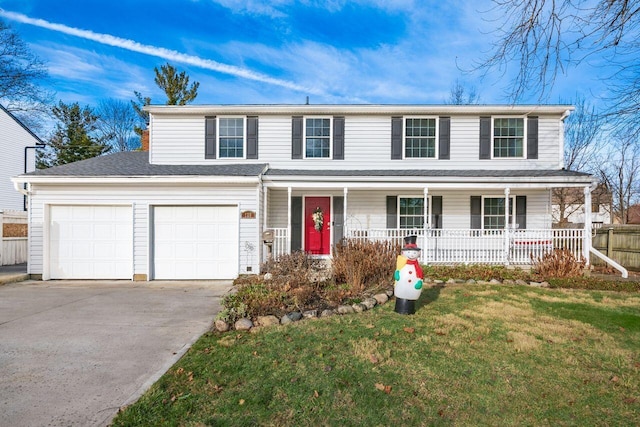 front facade featuring a front lawn, covered porch, and a garage