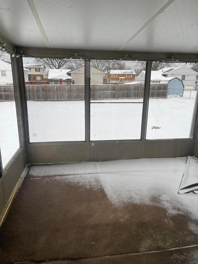 unfurnished sunroom with a healthy amount of sunlight