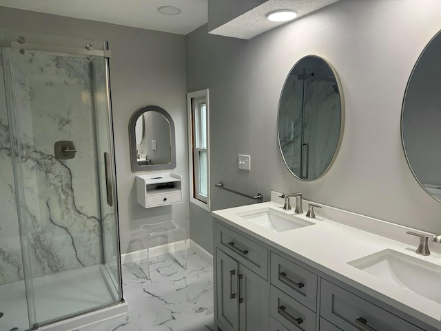 bathroom featuring vanity and an enclosed shower