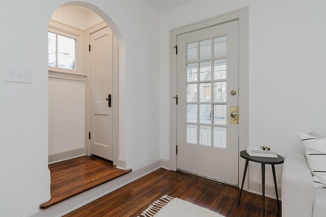 entryway with dark wood-type flooring