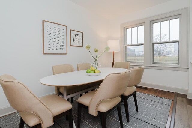 dining area featuring hardwood / wood-style floors