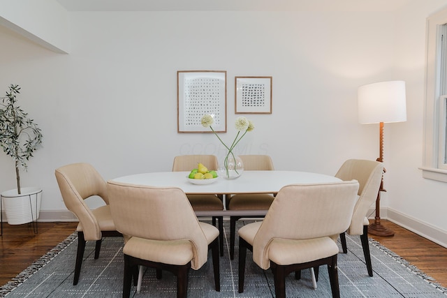 dining area with wood-type flooring