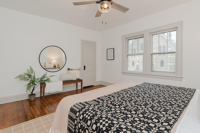 bedroom featuring ceiling fan and dark hardwood / wood-style floors