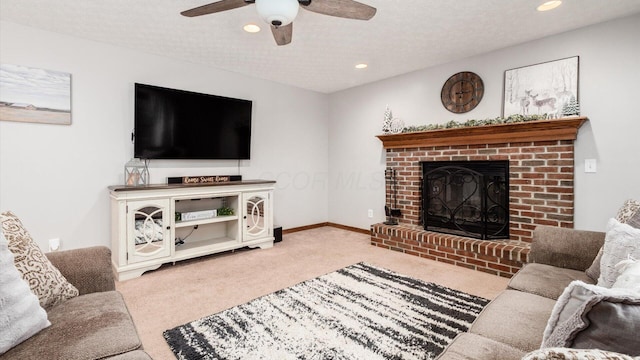 living room with carpet flooring, a textured ceiling, and a brick fireplace