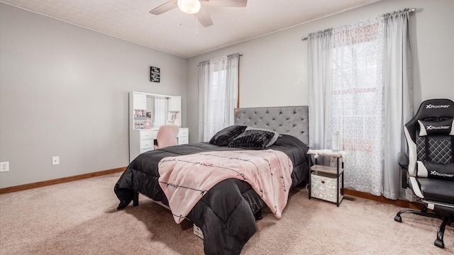 bedroom featuring light carpet and ceiling fan